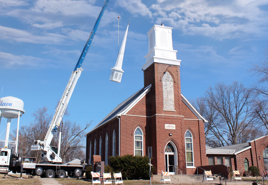 Steeple top being placed on Hoyleton Zion Evangelical United Church Of Christ in Mt. Vernon, Illinois
